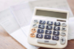 Image of a calculator on top of paperwork